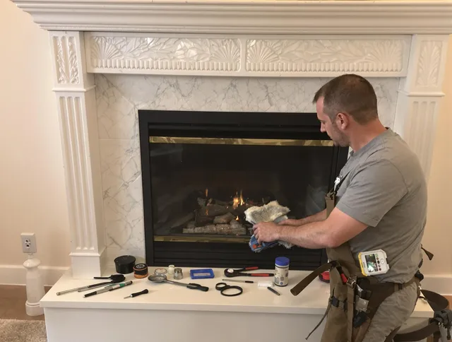 Rehoboth Chimney Sweep performing fireplace maintenance in Rehoboth, MA
