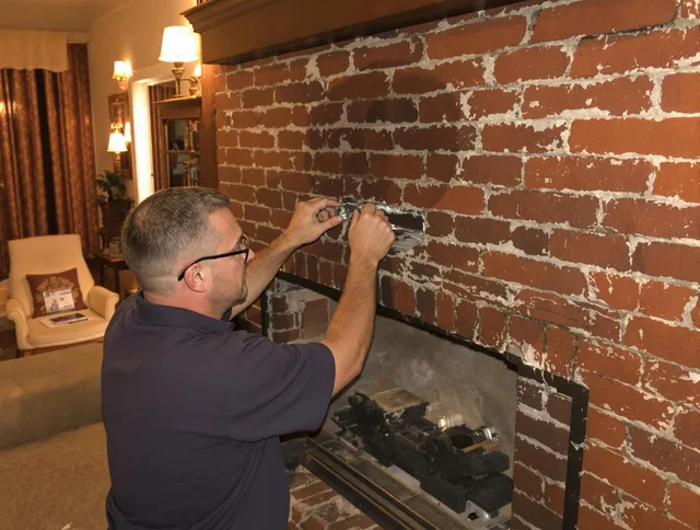 Rehoboth Chimney Sweep expert fixing a fireplace in Rehoboth, MA